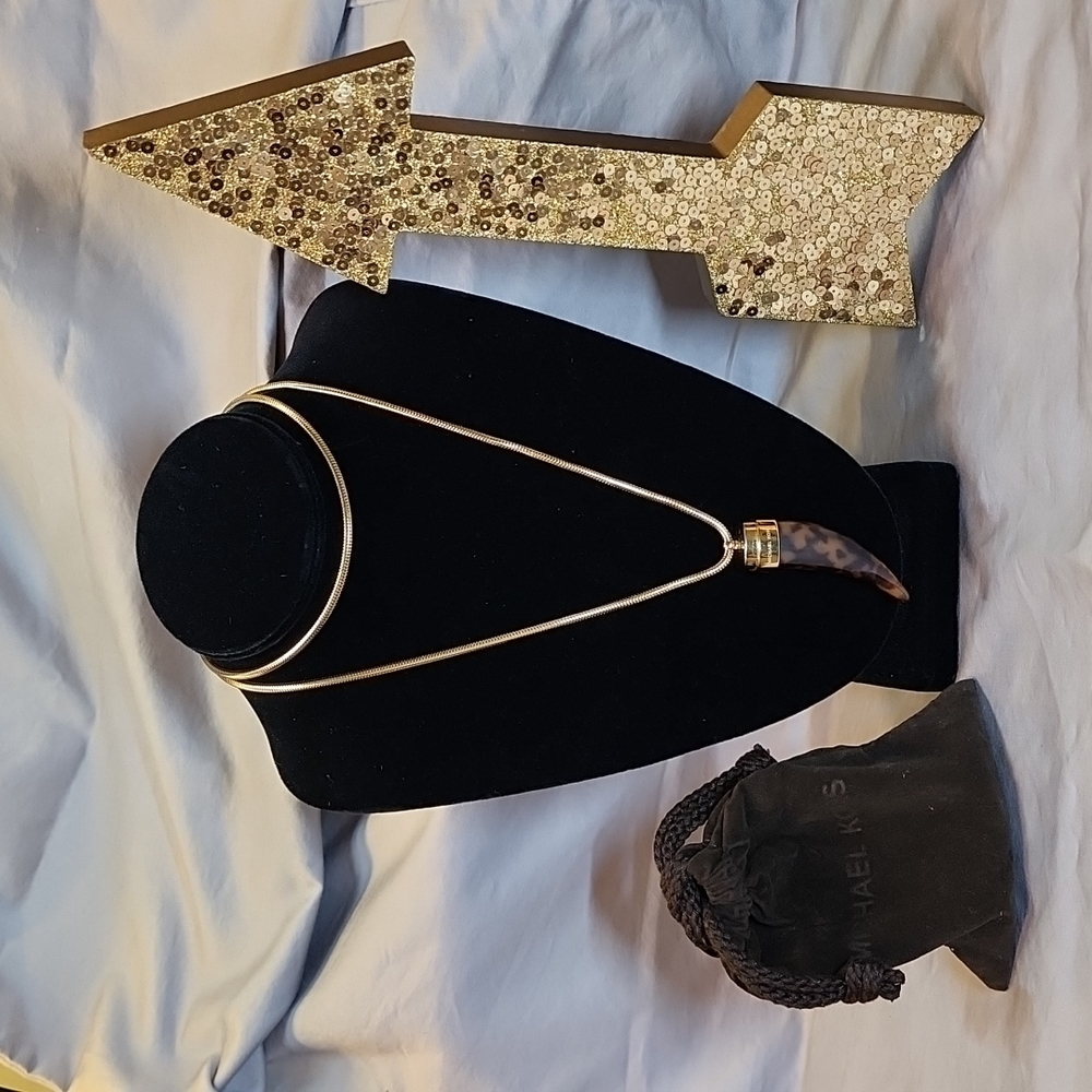 Michael Kors Tortoise horn pendant necklace.